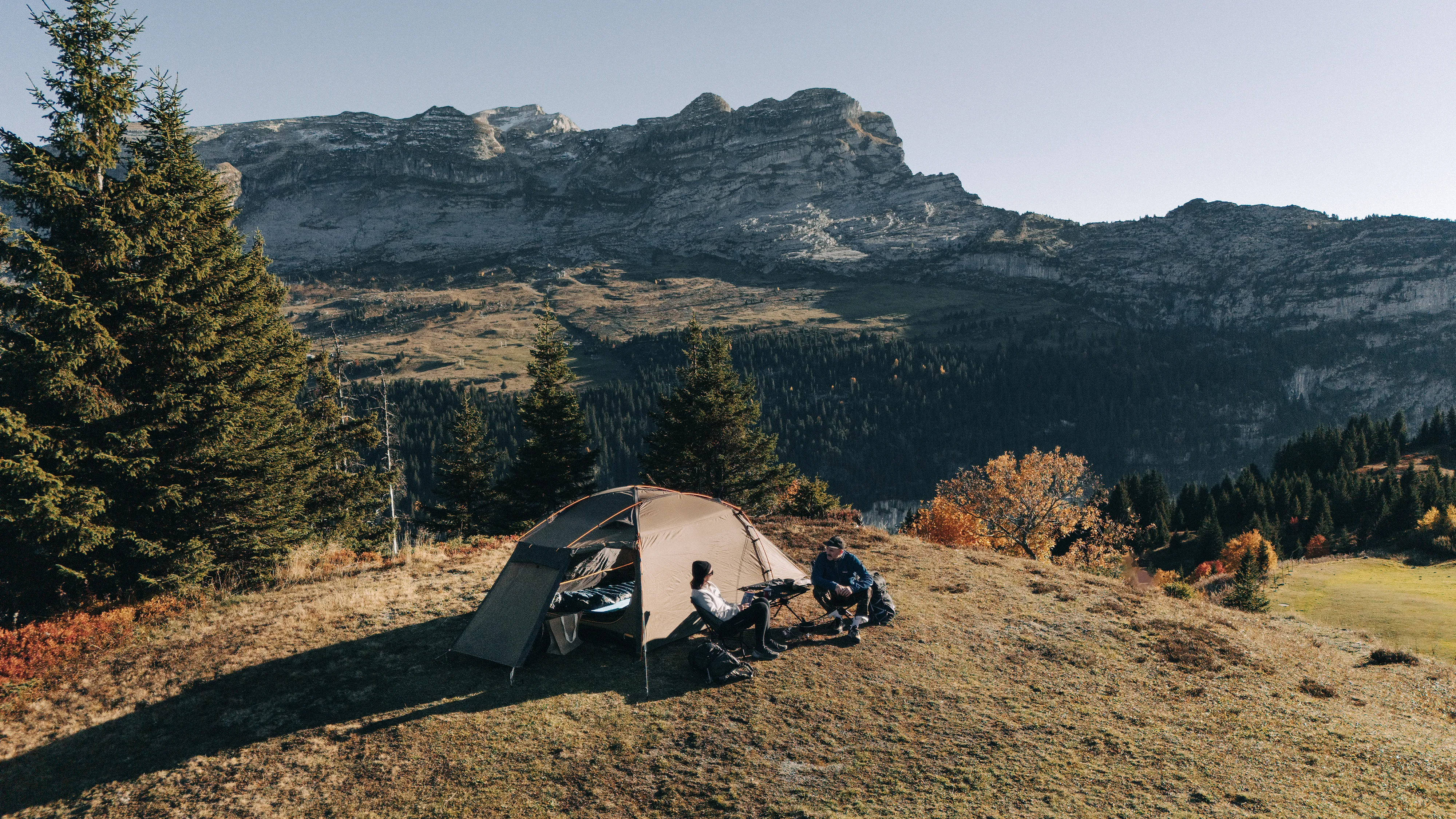 A Kampa tent pitched on top of a hill